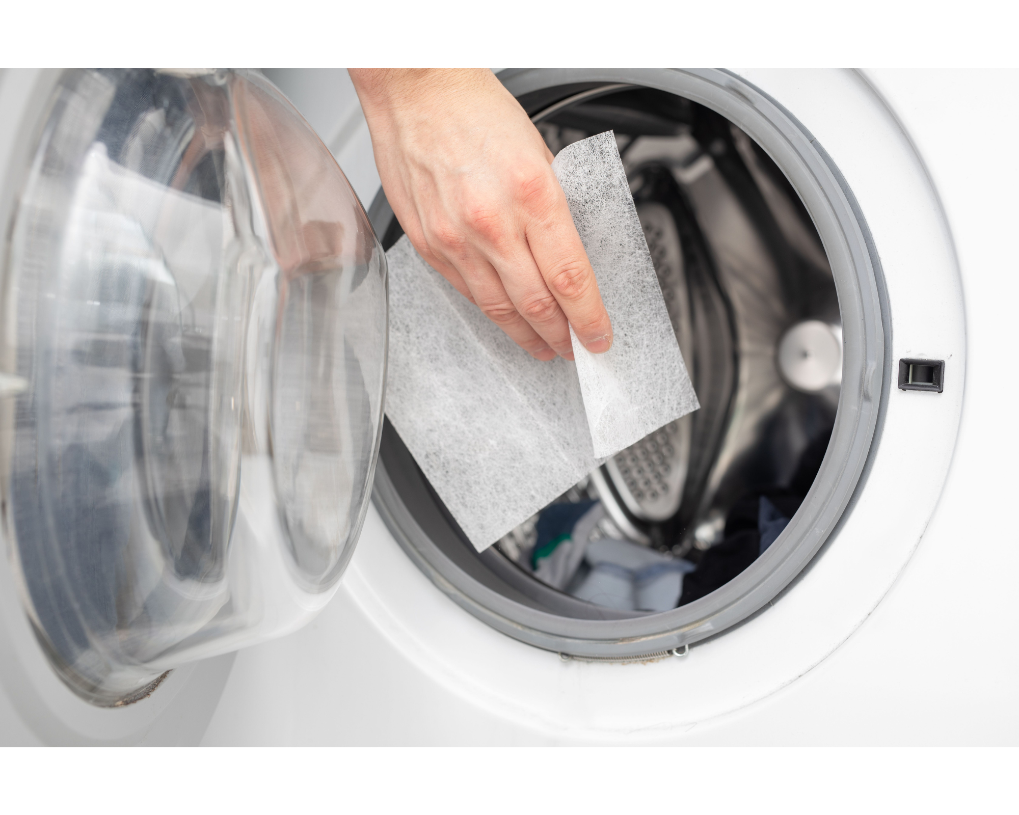 dryer with person putting a dryer sheet in