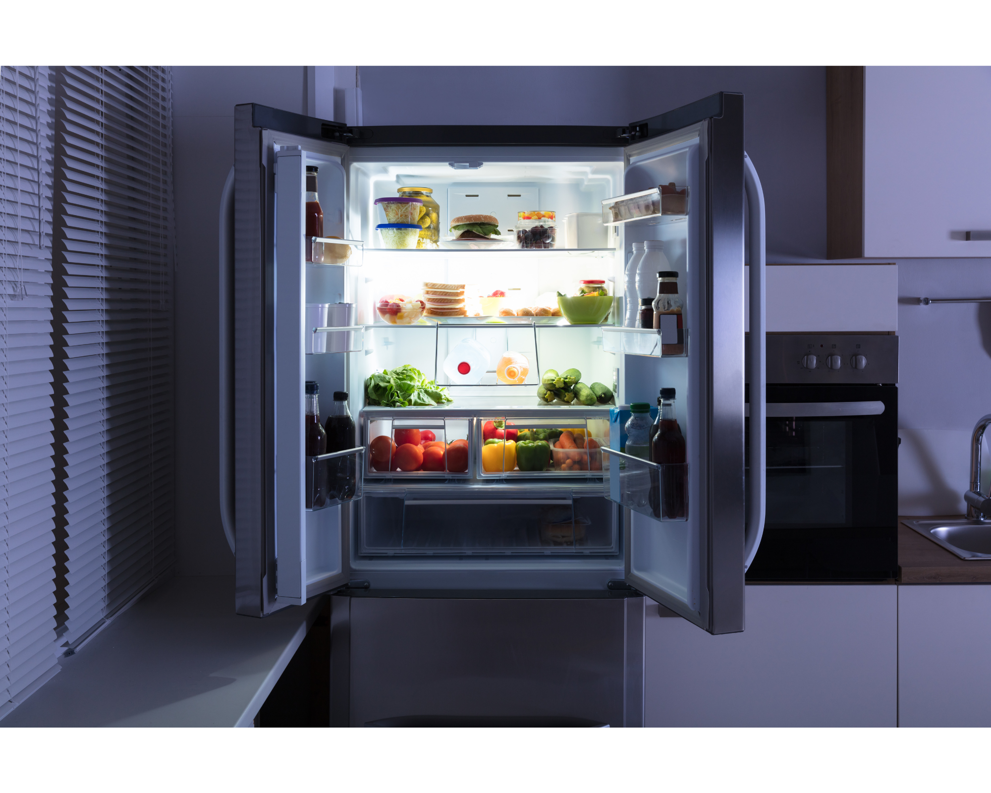 open refrigerator with fruits, vegetables, drinks