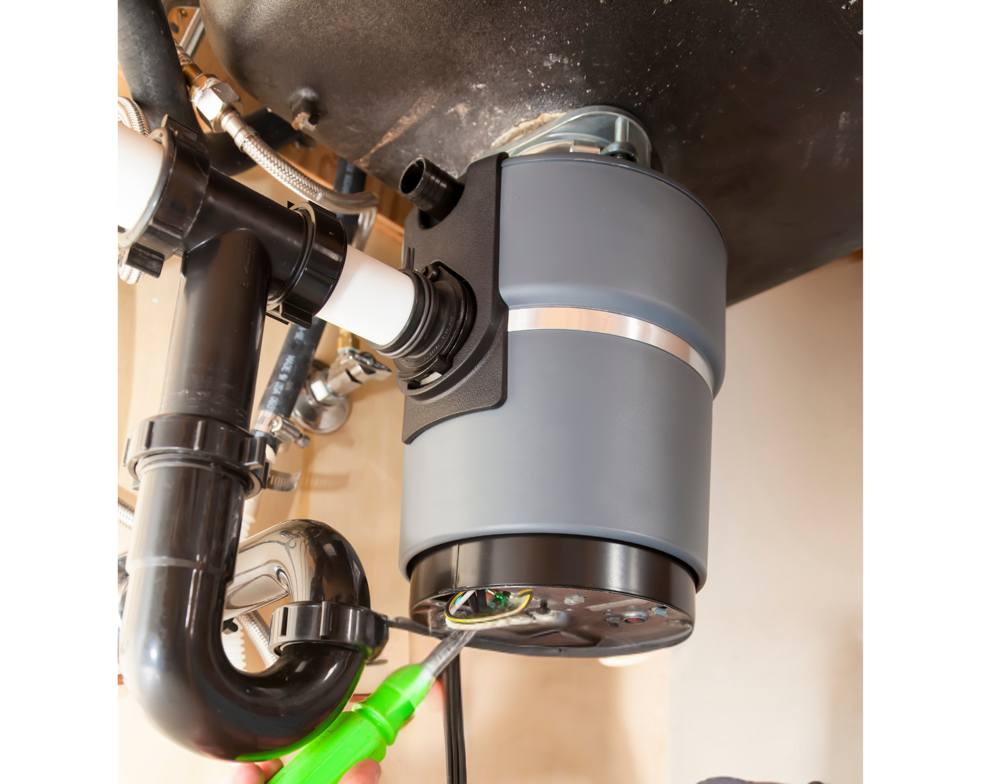 under the sink view of a garbage disposal